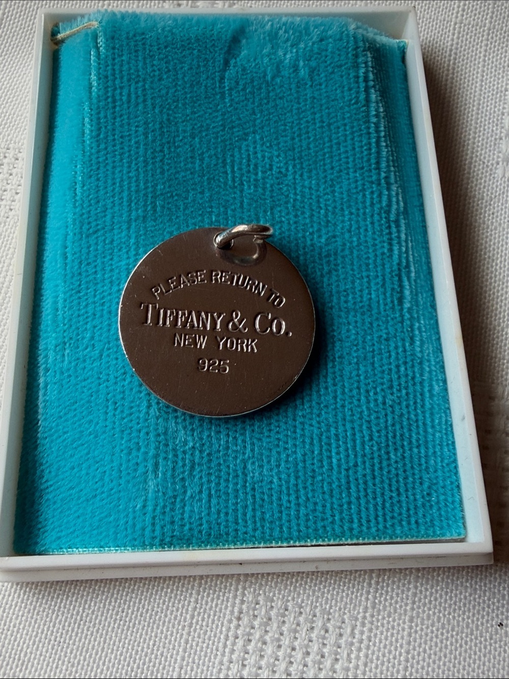 Tiffany & Co. Sterling Round Tag on Signature Blue Pad